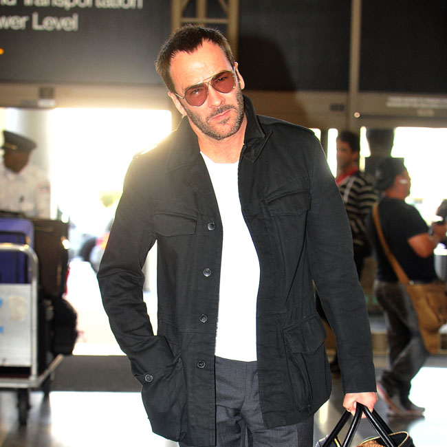 Tom Ford and his husband Richard Buckley head through LAX with their son Alexander to catch a flight to London. Pictured: Tom Ford Ref: SPL724304 220314 Picture by: Splash News Splash News and Pictures Los Angeles:310-821-2666 New York: 212-619-2666 London: 870-934-2666 photodesk@splashnews.com 