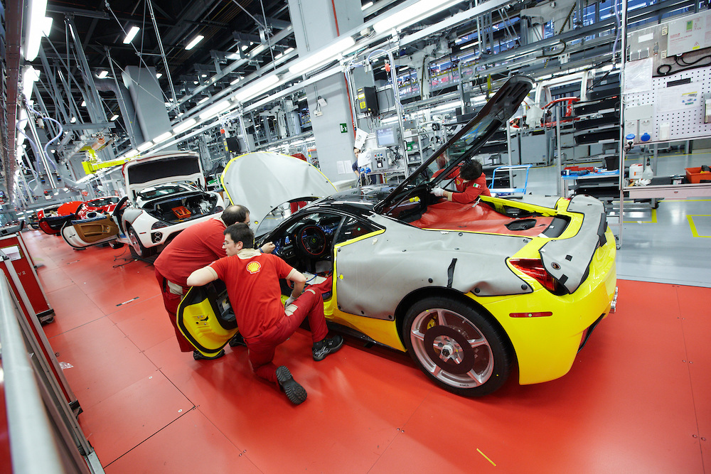 Ferrari sports cars, in this case the 458 Italia model, are constructed to specific order by clients at the Ferrari factory in Maranello, Italy. The company stresses that it is not an "assembly line."